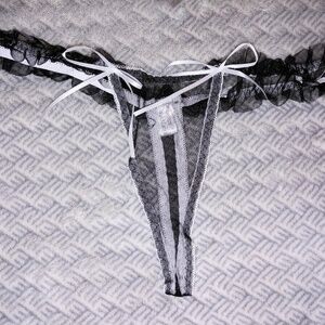 Black lace thong with white bows